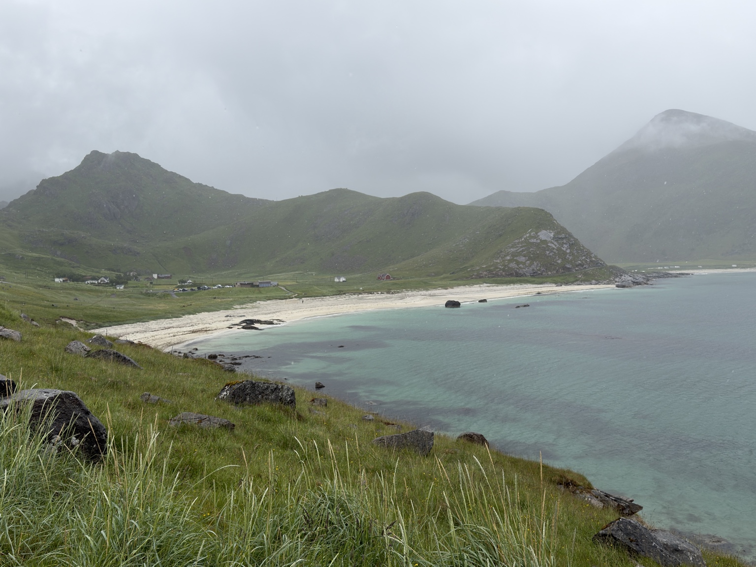 Pale sand and blue-green water during the Kvalvika outing.
