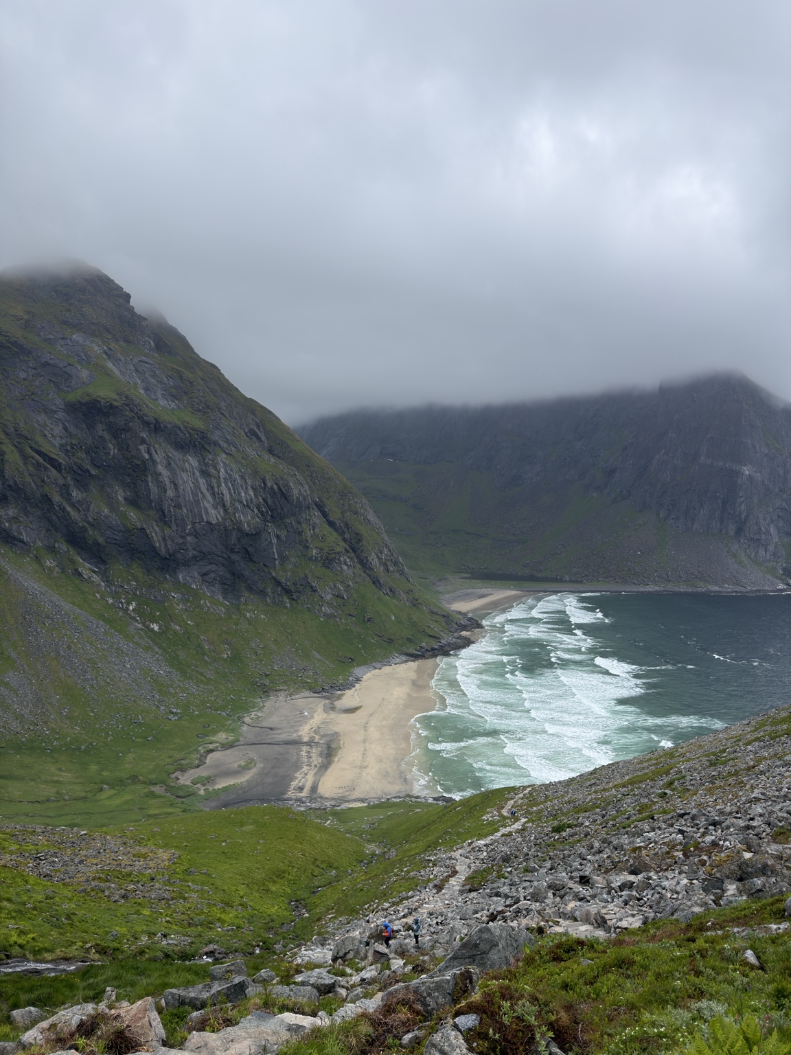 Looking down toward Kvalvika Beach in misty conditions.