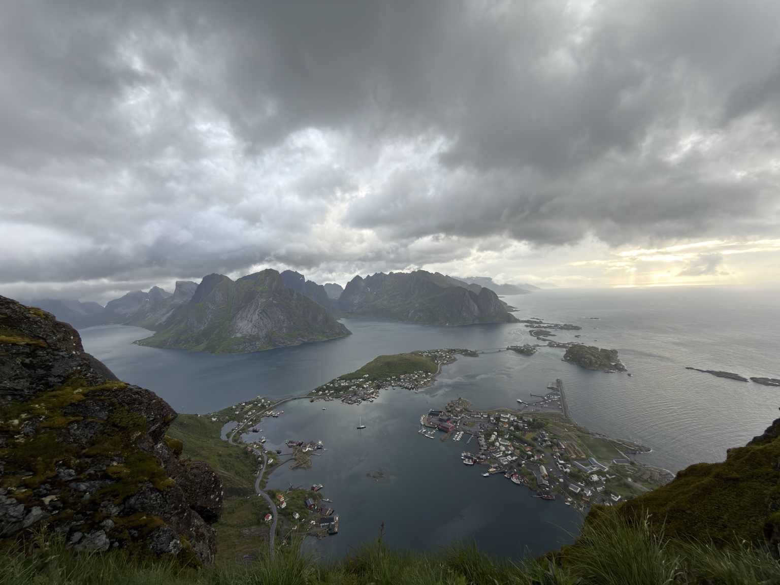 A broad view from Reinebringen, with the villages and water below.