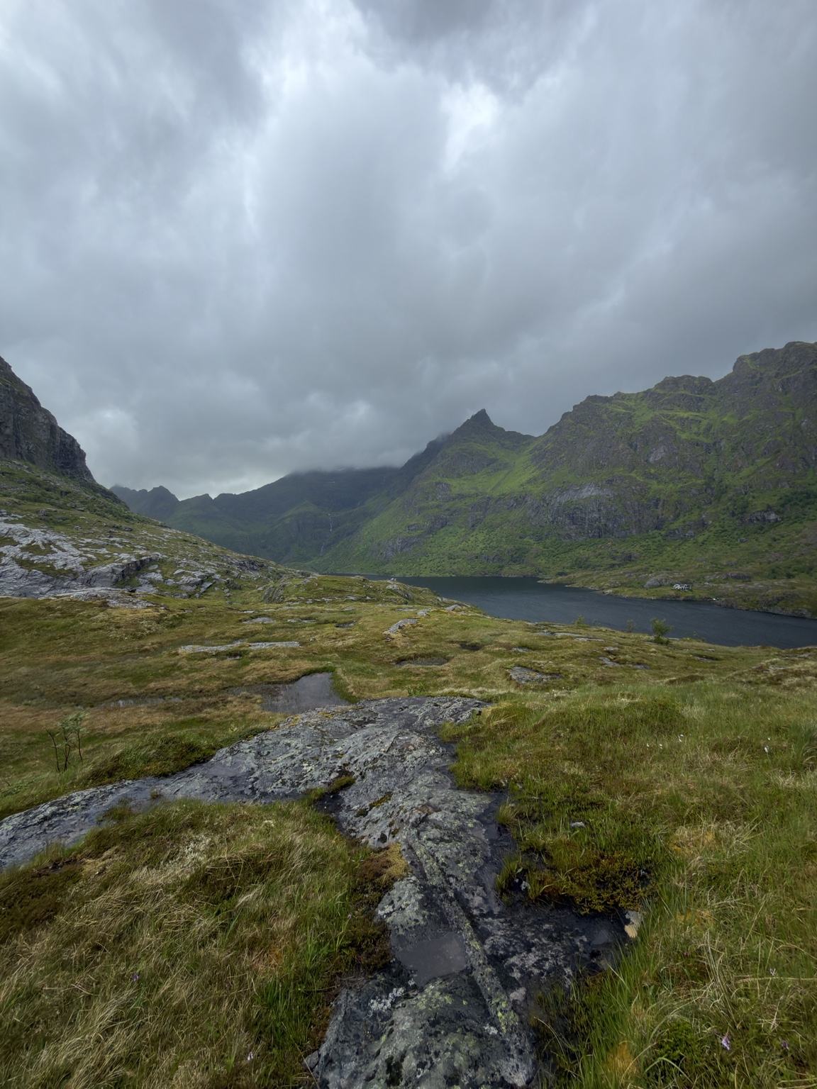 Rocky ground and a mountain lake during the outing near Å.